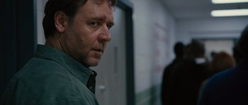 Movie still from “The Next Three Days” (2010), directed by Paul Haggis – A person wearing a shirt and a tie; Close Up shot, Over the shoulder angle