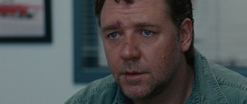 Movie still from “The Next Three Days” (2010), directed by Paul Haggis – A man with a bandage on his face; Close Up shot, Over the shoulder angle