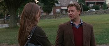 Movie still from “The Next Three Days” (2010), directed by Paul Haggis – A man and a woman standing next to each other in the grass; Medium shot, Over the shoulder angle