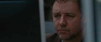 Movie still from “The Next Three Days” (2010), directed by Paul Haggis – A person looking at a computer screen; Close Up shot, Low angle