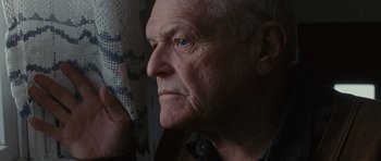 Movie still from “The Next Three Days” (2010), directed by Paul Haggis – An older man looking out of a window; Close Up shot, Low angle