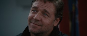 Movie still from “The Next Three Days” (2010), directed by Paul Haggis – A person with blue eyes smiling; Close Up shot, Over the shoulder angle