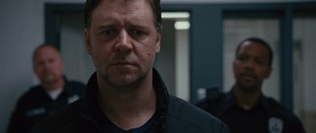 Movie still from “The Next Three Days” (2010), directed by Paul Haggis – A person wearing a jacket; Close Up shot, Over the shoulder angle