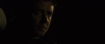Movie still from “The Next Three Days” (2010), directed by Paul Haggis – A person in a dark room; Close Up shot, Low angle