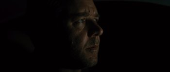 Movie still from “The Next Three Days” (2010), directed by Paul Haggis – A person's face with a dark background; Close Up shot, Low angle