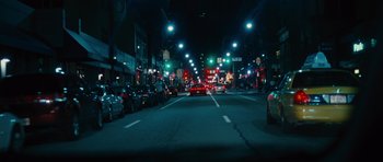 Movie still from “The Next Three Days” (2010), directed by Paul Haggis – A city street at night lit up by street lights; Extreme Wide shot, High angle