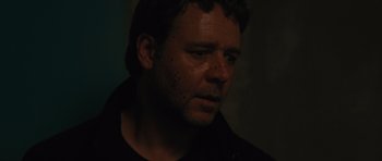 Movie still from “The Next Three Days” (2010), directed by Paul Haggis – A person wearing a black shirt; Close Up shot, Over the shoulder angle