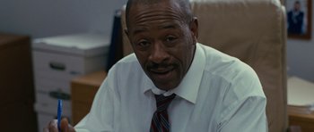 Movie still from “The Next Three Days” (2010), directed by Paul Haggis – An older man wearing a white shirt and a tie; Close Up shot, Low angle