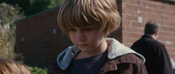 Movie still from “The Next Three Days” (2010), directed by Paul Haggis – A person wearing a jacket; Close Up shot, Over the shoulder angle