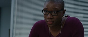 Movie still from “The Next Three Days” (2010), directed by Paul Haggis – A woman with glasses is talking on a cell phone; Close Up shot, Over the shoulder angle