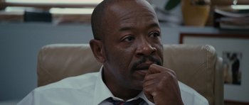 Movie still from “The Next Three Days” (2010), directed by Paul Haggis – A person wearing a suit and tie; Close Up shot, Over the shoulder angle