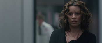 Movie still from “The Next Three Days” (2010), directed by Paul Haggis – A person with curly hair; Close Up shot, Over the shoulder angle
