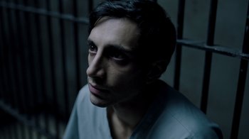 Movie still from “The Night Of” (2016), directed by James Marsh – A person in a jail cell; Close Up shot, High angle
