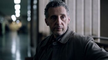 Movie still from “The Night Of” (2016), directed by James Marsh – A person wearing a jacket; Close Up shot, Over the shoulder angle