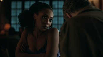Movie still from “The Night Of” (2016), directed by James Marsh – A woman sitting next to a man in a dark room; Close Up shot, Over the shoulder angle