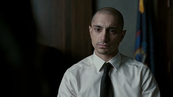 Movie still from “The Night Of” (2016), directed by James Marsh – A man in a white shirt and a black tie; Close Up shot, Over the shoulder angle