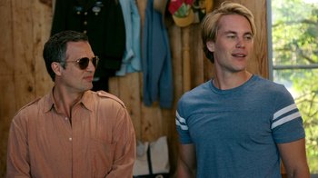 Movie still from “The Normal Heart” (2014), directed by Ryan Murphy – Two men standing next to each other in front of a closet; Medium shot, Over the shoulder angle