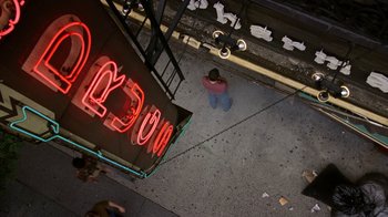 Movie still from “The Normal Heart” (2014), directed by Ryan Murphy – An overhead view of a person sitting on the ground; Extreme Wide shot, Overhead angle