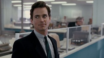 Movie still from “The Normal Heart” (2014), directed by Ryan Murphy – A person wearing a suit and tie; Close Up shot, Over the shoulder angle