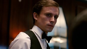 Movie still from “The Normal Heart” (2014), directed by Ryan Murphy – A young man in a black and white suit and bow tie; Close Up shot, Low angle