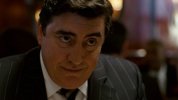 Movie still from “The Normal Heart” (2014), directed by Ryan Murphy – A person wearing a suit and tie; Close Up shot, Over the shoulder angle