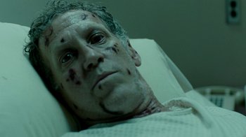 Movie still from “The Normal Heart” (2014), directed by Ryan Murphy – A man in a hospital bed covered in blood; Close Up shot, High angle