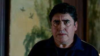 Movie still from “The Normal Heart” (2014), directed by Ryan Murphy – A person with a painting in the background; Close Up shot, Low angle