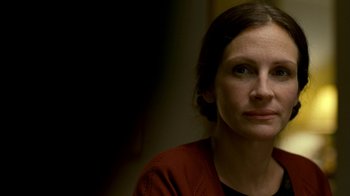 Movie still from “The Normal Heart” (2014), directed by Ryan Murphy – A person wearing a red shirt; Close Up shot, Over the shoulder angle