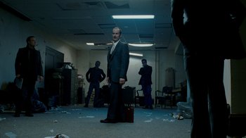Movie still from “The Normal Heart” (2014), directed by Ryan Murphy – A man in a suit standing in a room; Wide shot, Low angle