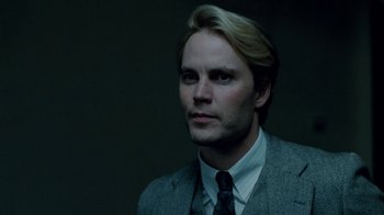 Movie still from “The Normal Heart” (2014), directed by Ryan Murphy – A man with blonde hair wearing a suit and tie; Close Up shot, Over the shoulder angle