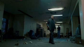 Movie still from “The Normal Heart” (2014), directed by Ryan Murphy – A man standing in an empty room surrounded by debris; Wide shot, Low angle