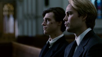 Movie still from “The Normal Heart” (2014), directed by Ryan Murphy – A couple of men sitting next to each other in a room; Close Up shot, Low angle