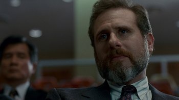 Movie still from “The Normal Heart” (2014), directed by Ryan Murphy – A person wearing a suit and tie; Close Up shot, Over the shoulder angle