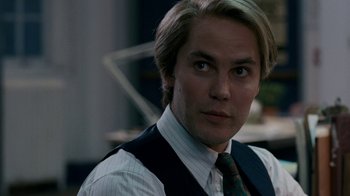 Movie still from “The Normal Heart” (2014), directed by Ryan Murphy – A person wearing a suit and tie; Close Up shot, Over the shoulder angle