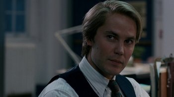 Movie still from “The Normal Heart” (2014), directed by Ryan Murphy – A person wearing a suit and tie; Close Up shot, Over the shoulder angle