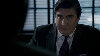 Movie still from “The Normal Heart” (2014), directed by Ryan Murphy – A person wearing a suit and tie; Close Up shot, Over the shoulder angle