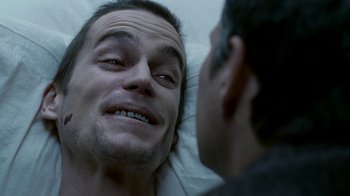 Movie still from “The Normal Heart” (2014), directed by Ryan Murphy – A person laying in a bed with another person; Close Up shot, Over the shoulder angle