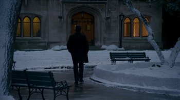 Movie still from “The Normal Heart” (2014), directed by Ryan Murphy – A man walking in front of a building with snow on the ground; Extreme Wide shot, High angle