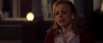 Movie still from “The Notebook” (2004), directed by Nick Cassavetes – A young woman is crying while standing in a dark room; Close Up shot, Over the shoulder angle