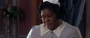 Movie still from “The Notebook” (2004), directed by Nick Cassavetes – An older black woman wearing a white hat; Close Up shot, Low angle