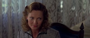 Movie still from “The Notebook” (2004), directed by Nick Cassavetes – A person sitting in a chair; Close Up shot, Low angle