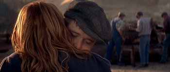Movie still from “The Notebook” (2004), directed by Nick Cassavetes – A young man and a woman embracing each other; Close Up shot, Over the shoulder angle