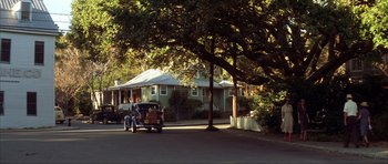 Movie still from “The Notebook” (2004), directed by Nick Cassavetes – An old car parked on the side of the street; Extreme Wide shot, High angle