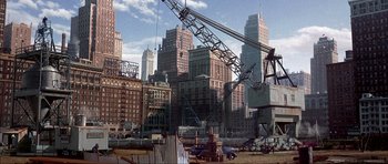 Movie still from “The Notebook” (2004), directed by Nick Cassavetes – A large crane in the middle of a construction site; Extreme Wide shot, High angle