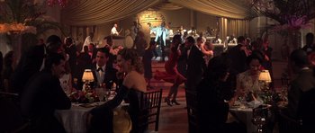 Movie still from “The Notebook” (2004), directed by Nick Cassavetes – A group of people sitting at a table in a room; Wide shot, High angle