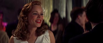 Movie still from “The Notebook” (2004), directed by Nick Cassavetes – A woman with blonde hair wearing a white dress; Close Up shot, Over the shoulder angle