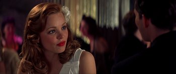 Movie still from “The Notebook” (2004), directed by Nick Cassavetes – A beautiful young woman with a flower in her hair; Close Up shot, Over the shoulder angle