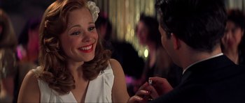 Movie still from “The Notebook” (2004), directed by Nick Cassavetes – A woman smiling at a man holding a ring; Close Up shot, Over the shoulder angle