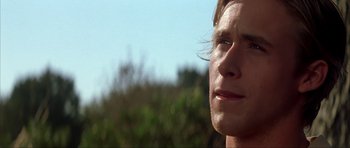 Movie still from “The Notebook” (2004), directed by Nick Cassavetes – A man's face with trees in the background; Close Up shot, Over the shoulder angle