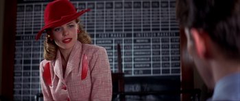 Movie still from “The Notebook” (2004), directed by Nick Cassavetes – A woman wearing a red hat and a red jacket; Medium shot, Low angle